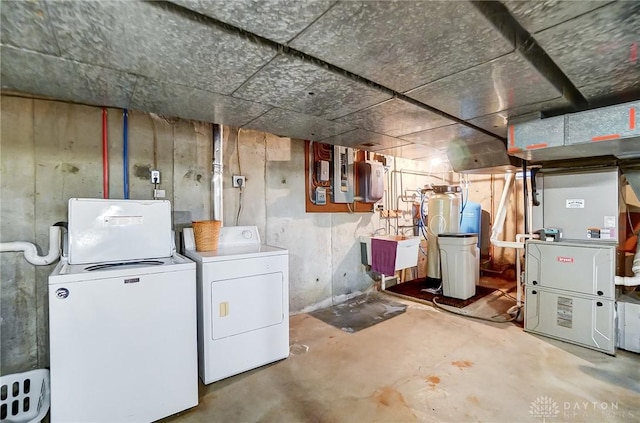 basement featuring washer and dryer and sink