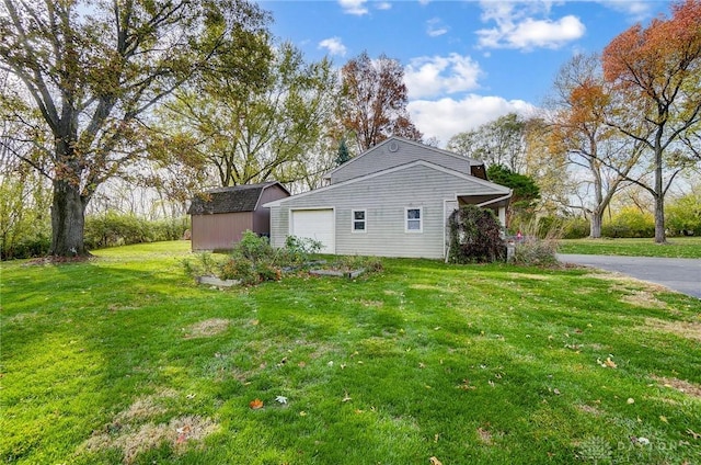 view of property exterior with a yard and a storage unit