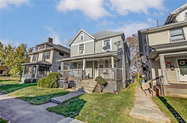 view of front of property featuring covered porch and a front yard