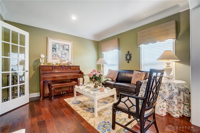 sitting room featuring dark hardwood / wood-style floors, plenty of natural light, and crown molding