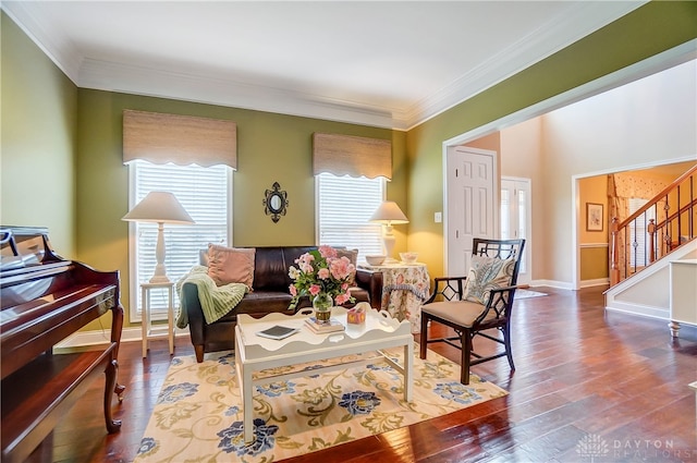 sitting room with hardwood / wood-style flooring and ornamental molding