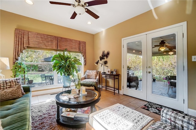 interior space featuring ceiling fan, light tile patterned flooring, and french doors