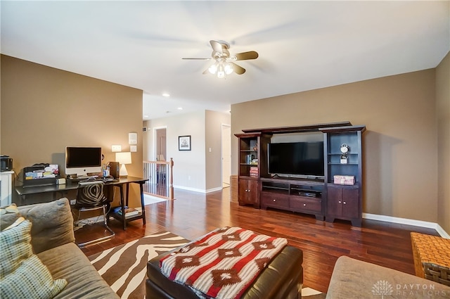 living room featuring dark hardwood / wood-style flooring and ceiling fan