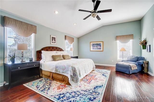 bedroom featuring multiple windows, ceiling fan, dark wood-type flooring, and lofted ceiling