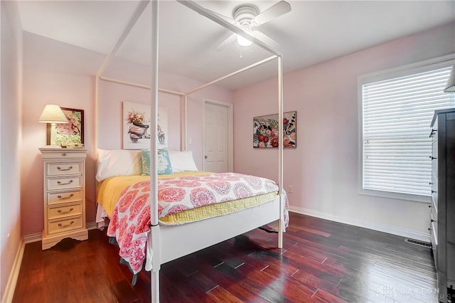 bedroom featuring dark hardwood / wood-style flooring, a closet, and ceiling fan