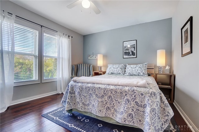 bedroom featuring dark hardwood / wood-style floors and ceiling fan