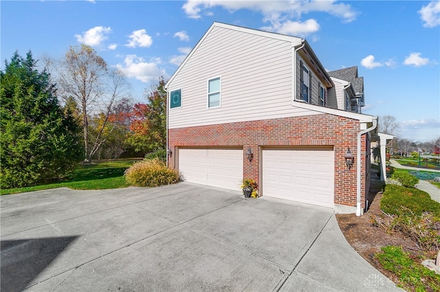 view of side of home featuring a garage