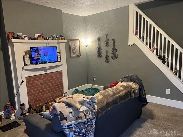 interior space featuring a textured ceiling and carpet floors