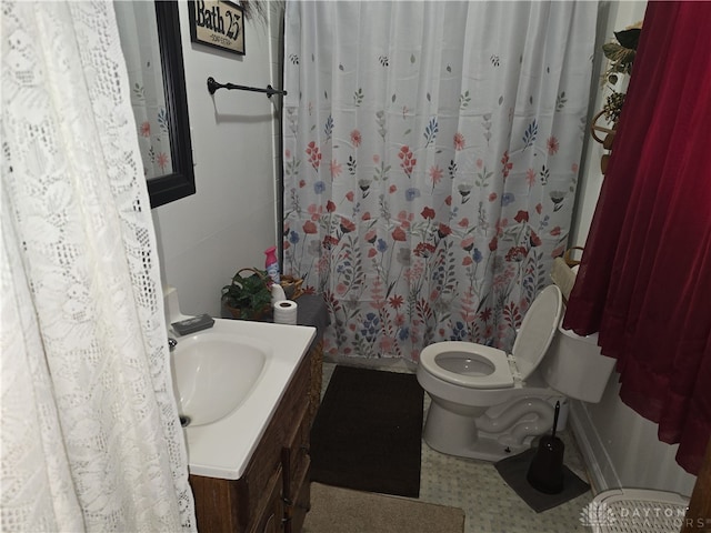 bathroom featuring vanity and toilet