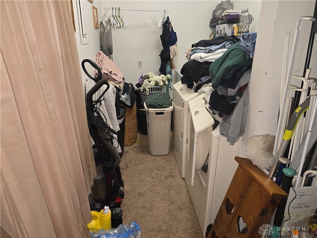 storage area featuring washer and clothes dryer