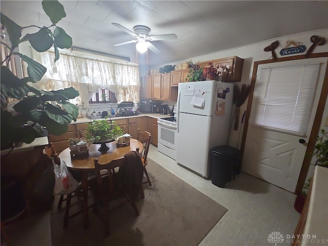 kitchen featuring white appliances and ceiling fan