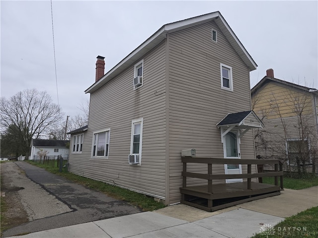 view of home's exterior with a deck