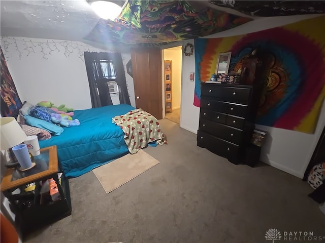 carpeted bedroom with vaulted ceiling