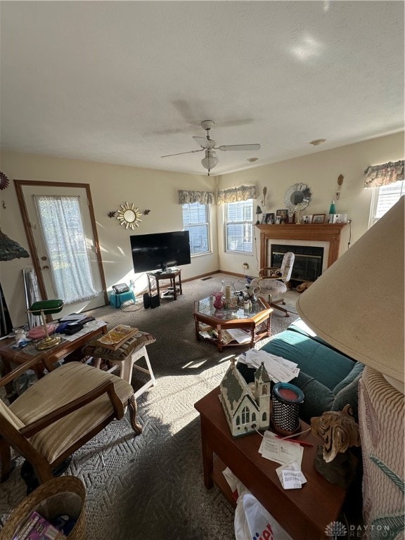 living room featuring carpet floors and ceiling fan