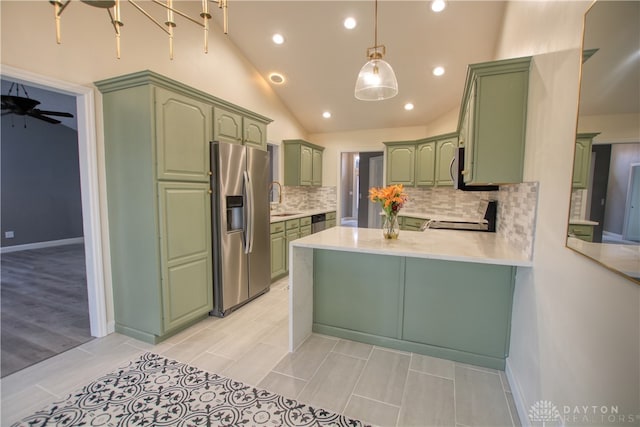 kitchen featuring ceiling fan, kitchen peninsula, decorative light fixtures, appliances with stainless steel finishes, and green cabinetry