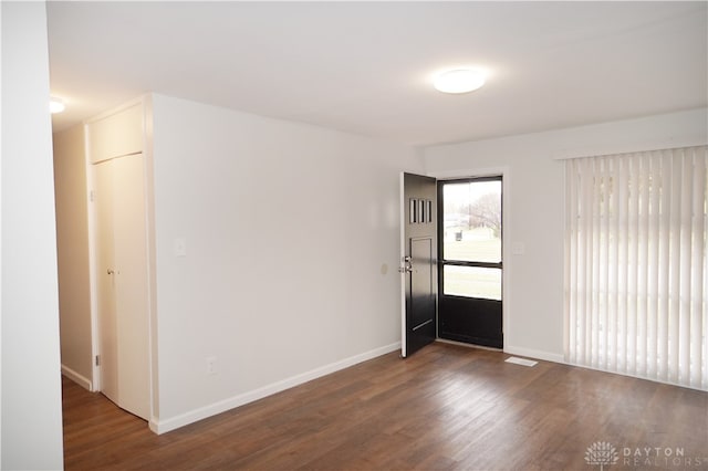 empty room featuring dark hardwood / wood-style floors