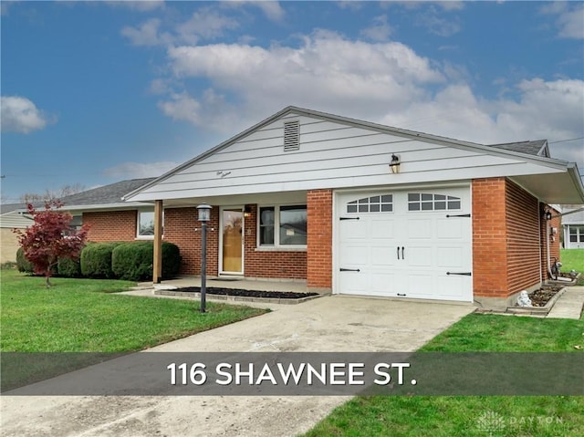 view of front of property with a garage and a front yard