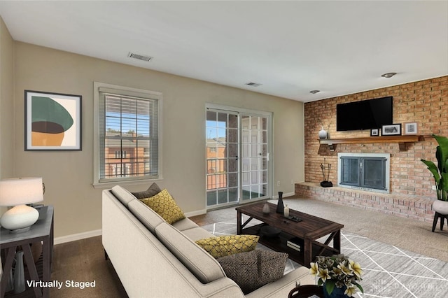 living room featuring a fireplace and carpet floors