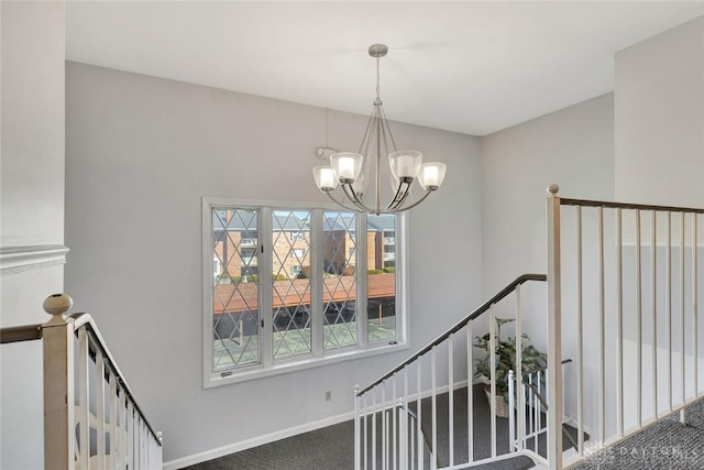 staircase with carpet and a notable chandelier