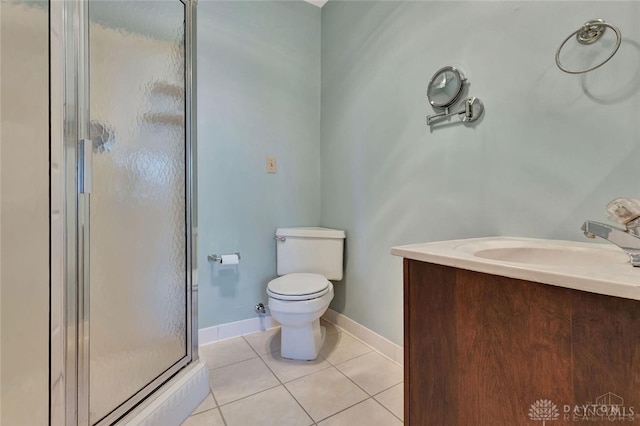 bathroom with tile patterned flooring, toilet, sink, and walk in shower