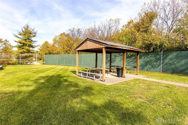 view of yard featuring a gazebo and a water view