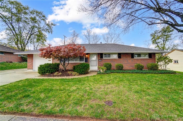 ranch-style home featuring a garage and a front lawn