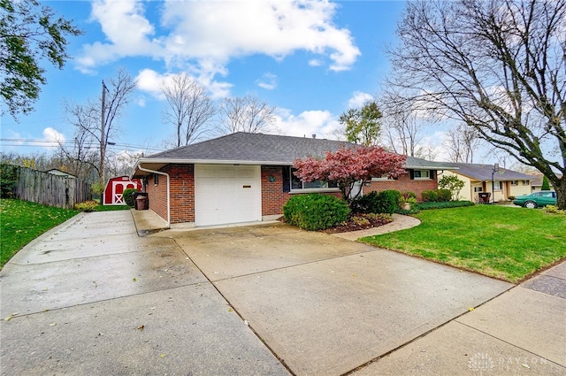 single story home featuring a garage and a front lawn