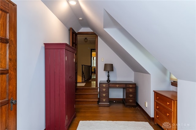 additional living space featuring dark hardwood / wood-style floors and vaulted ceiling