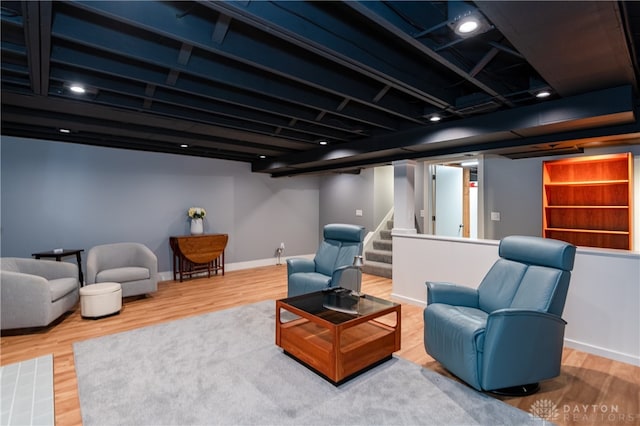 living area with hardwood / wood-style floors