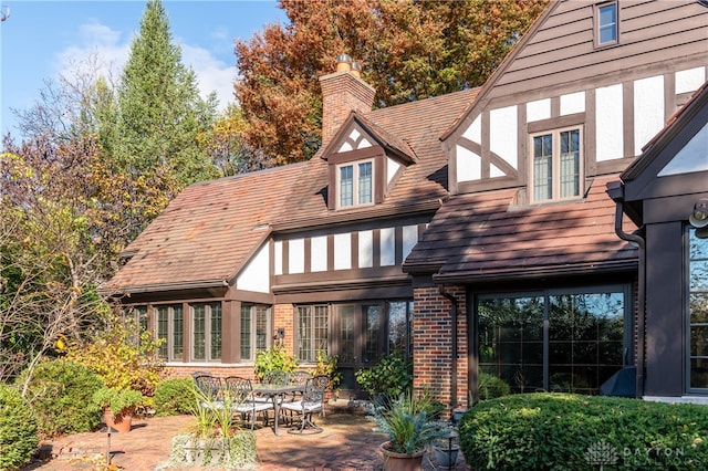 back of property featuring a patio area