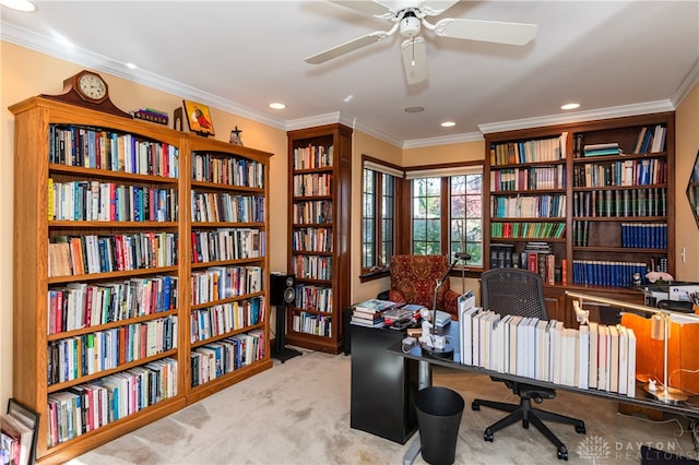 carpeted office featuring crown molding and ceiling fan