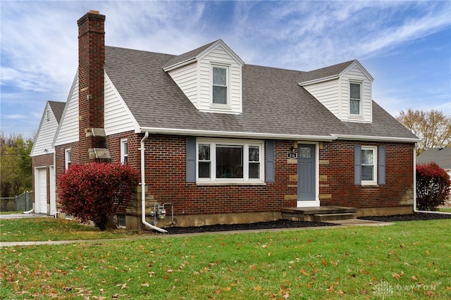 cape cod-style house with a front lawn and a garage