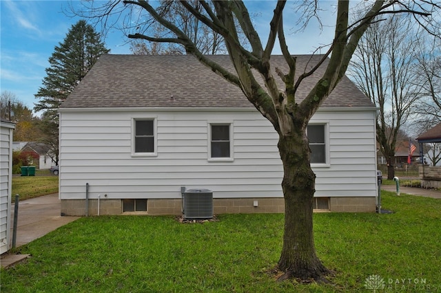 view of home's exterior featuring a yard and cooling unit