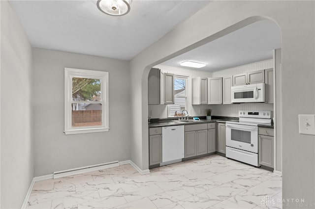 kitchen featuring gray cabinetry, white appliances, sink, and a baseboard heating unit