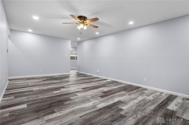 unfurnished room featuring dark hardwood / wood-style flooring and ceiling fan