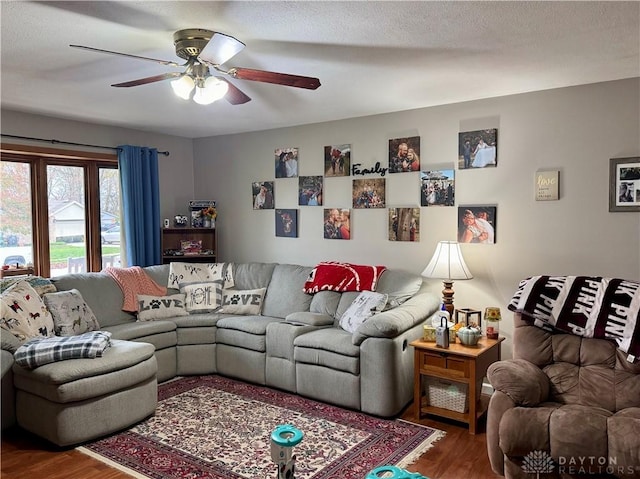 living room featuring hardwood / wood-style flooring and ceiling fan