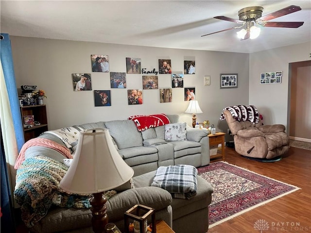 living room with hardwood / wood-style flooring and ceiling fan