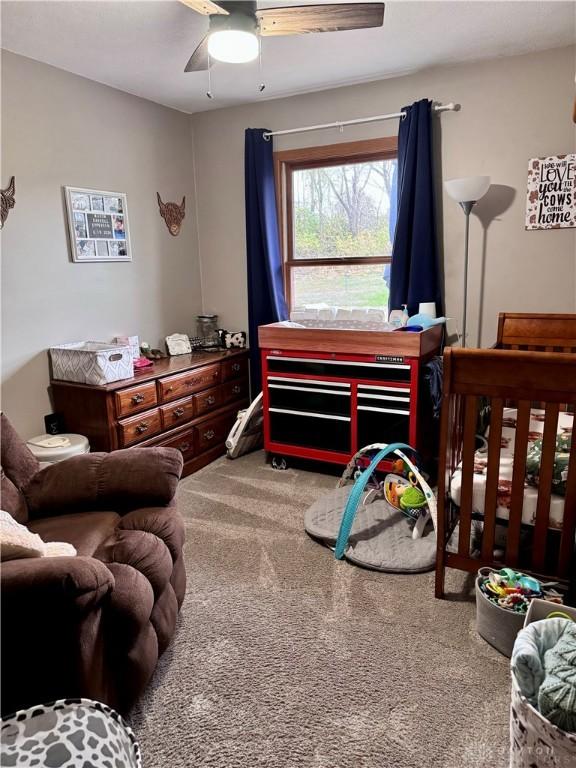 carpeted bedroom with ceiling fan