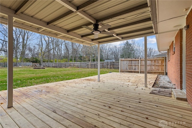 wooden terrace with a yard and ceiling fan