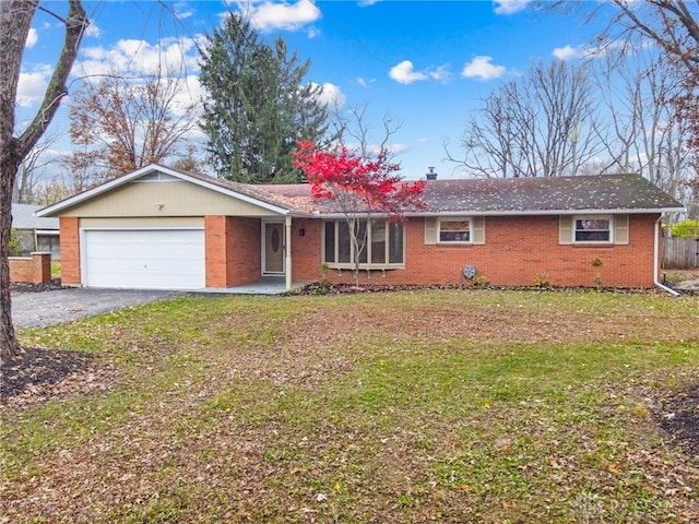 ranch-style house with a front lawn and a garage