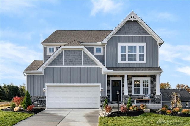 craftsman-style home featuring a porch and a garage