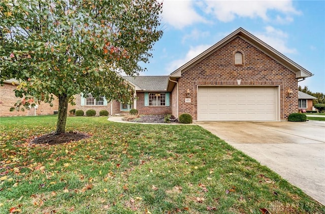 view of front of property with a garage and a front yard