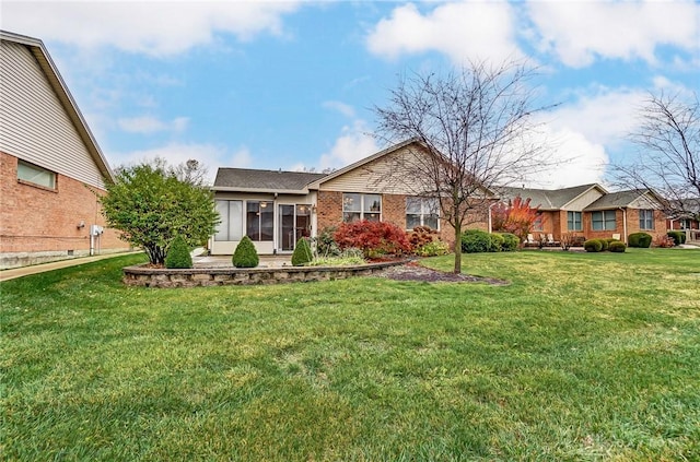 ranch-style house with a front lawn