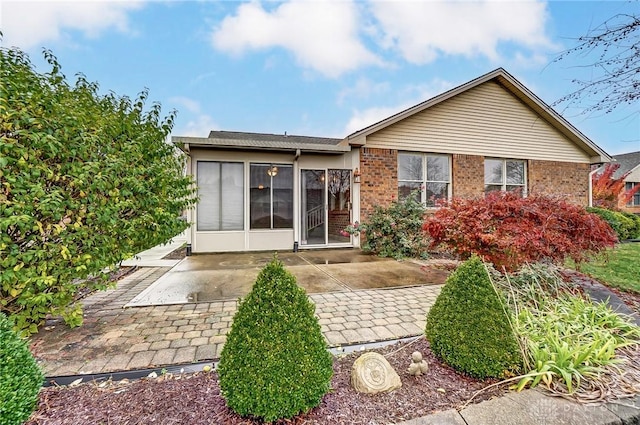 back of property with a patio area