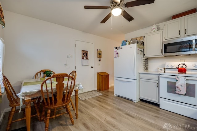 kitchen featuring ceiling fan, white cabinets, light hardwood / wood-style floors, and white appliances