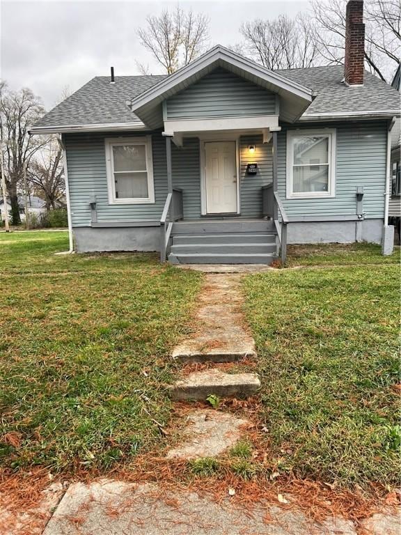 view of front of home with a front yard