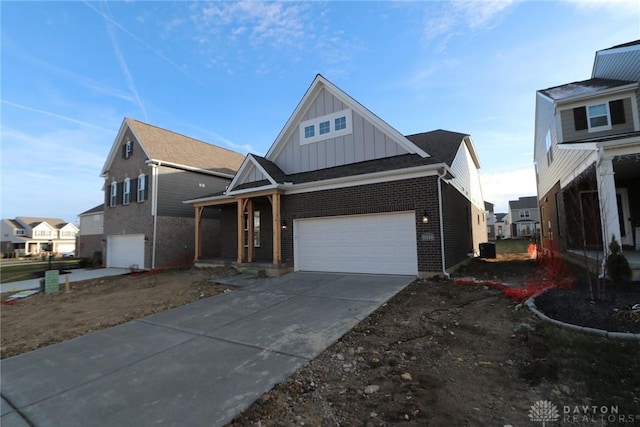 view of front facade featuring a garage, concrete driveway, a residential view, board and batten siding, and brick siding