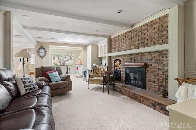 living room featuring carpet, beam ceiling, and a fireplace