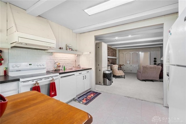 kitchen with premium range hood, white appliances, sink, beam ceiling, and white cabinets