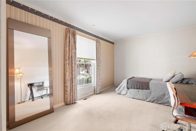 carpeted bedroom with ornamental molding